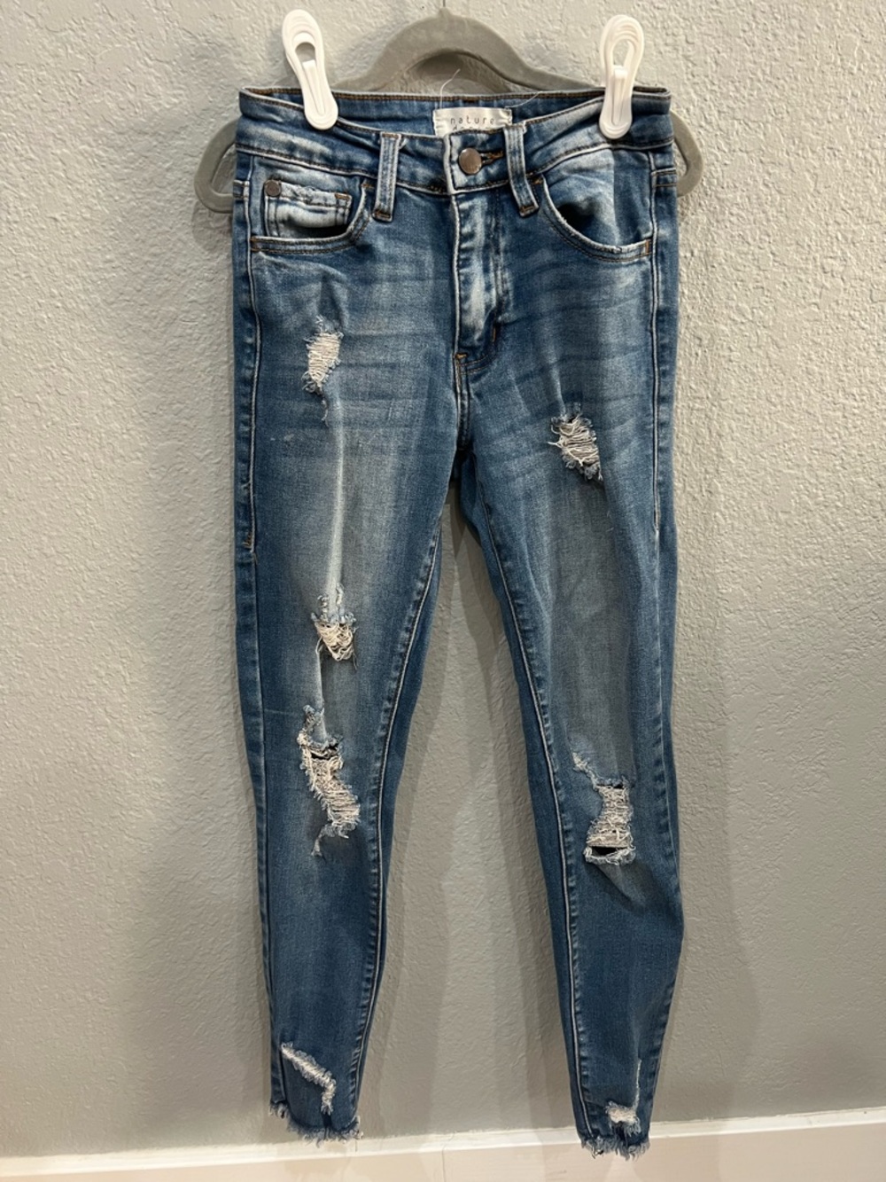 Women’s Distressed Skinny Jeans in Mid Blue